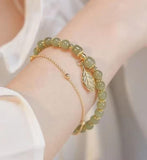 Pulseira dourada em pedras